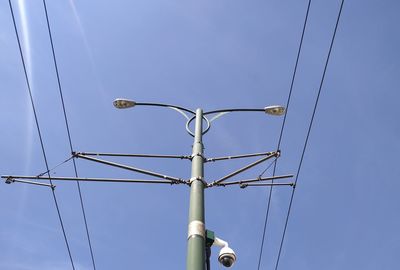 Low angle view of street light against sky