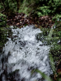 Blurred motion of water flowing through rocks