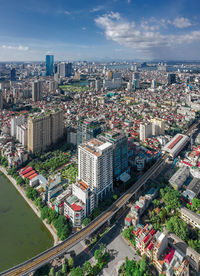 High angle view of street amidst buildings against sky