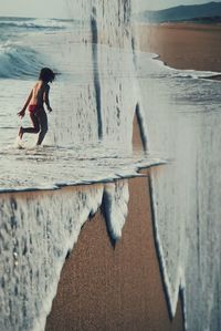 Side view of woman on beach