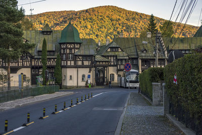 Street by buildings in city