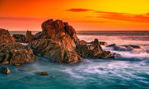 Scenic view of sea against sky during sunset