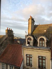 Buildings in city against sky