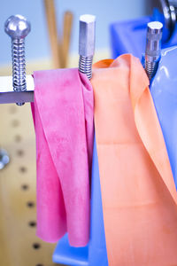Close-up of clothes hanging on paper