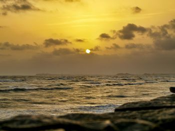 Scenic view of sea at sunset