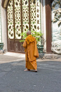 Rear view of a man walking in a building