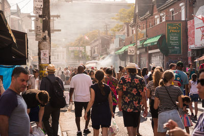 Group of people walking on city street