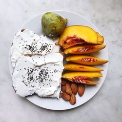 High angle view of fruits in plate on table