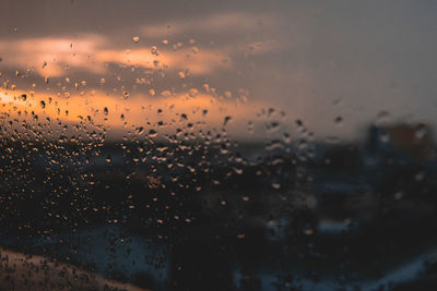 Full frame shot of wet glass window during rainy season