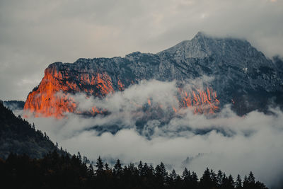 Scenic view of mountain against cloudy sky