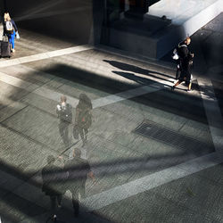 High angle view of people walking on street