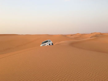 Scenic view of desert against clear sky