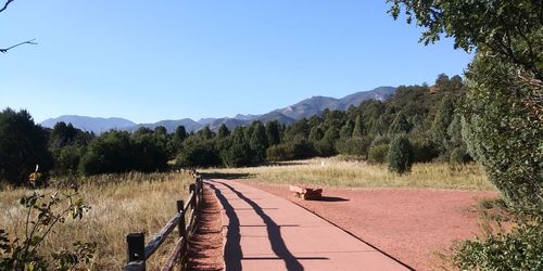 Scenic view of mountains against clear blue sky