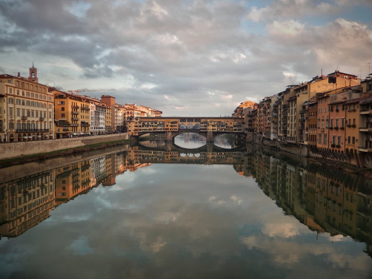 cloud - sky, sky, built structure, architecture, reflection, water, connection, building exterior, waterfront, bridge, bridge - man made structure, nature, river, city, no people, travel destinations, symmetry, outdoors, transportation, arch bridge