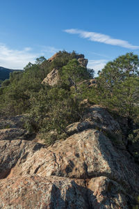 Rock formation on mountain against sky