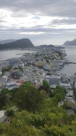 High angle view of city against cloudy sky