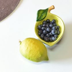 High angle view of fruits in bowl on table