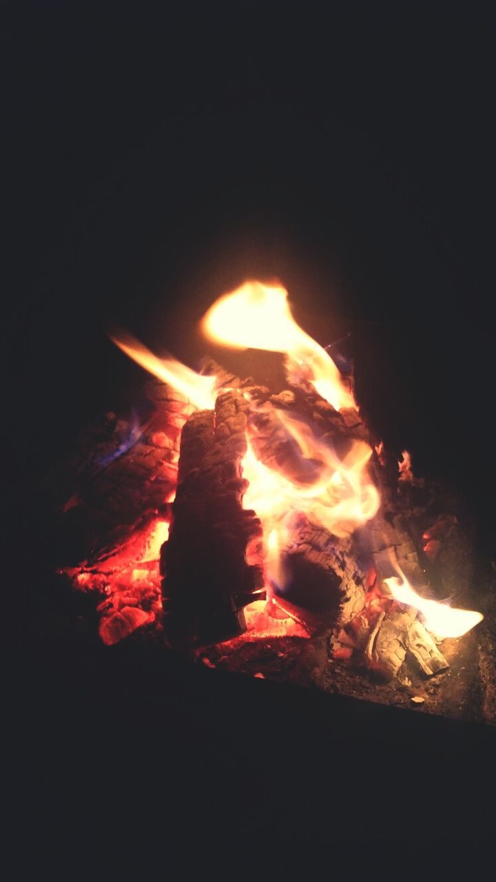 flame, burning, fire - natural phenomenon, heat - temperature, glowing, night, fire, bonfire, dark, close-up, heat, firewood, illuminated, copy space, black background, orange color, studio shot, campfire, candle, light - natural phenomenon