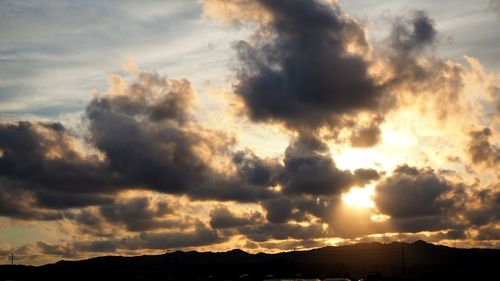 Low angle view of dramatic sky during sunset