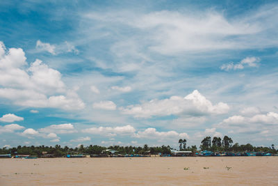 Scenic view of sea and buildings against sky