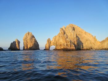 Panoramic view of sea against clear blue sky