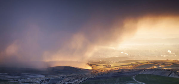 Scenic view of landscape against sky during sunset