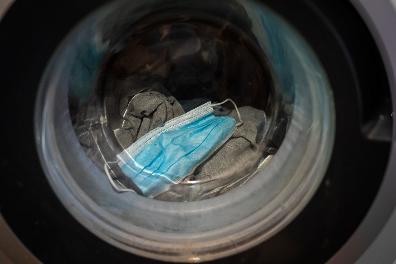 HIGH ANGLE VIEW OF GLASS WITH REFLECTION OF WATER