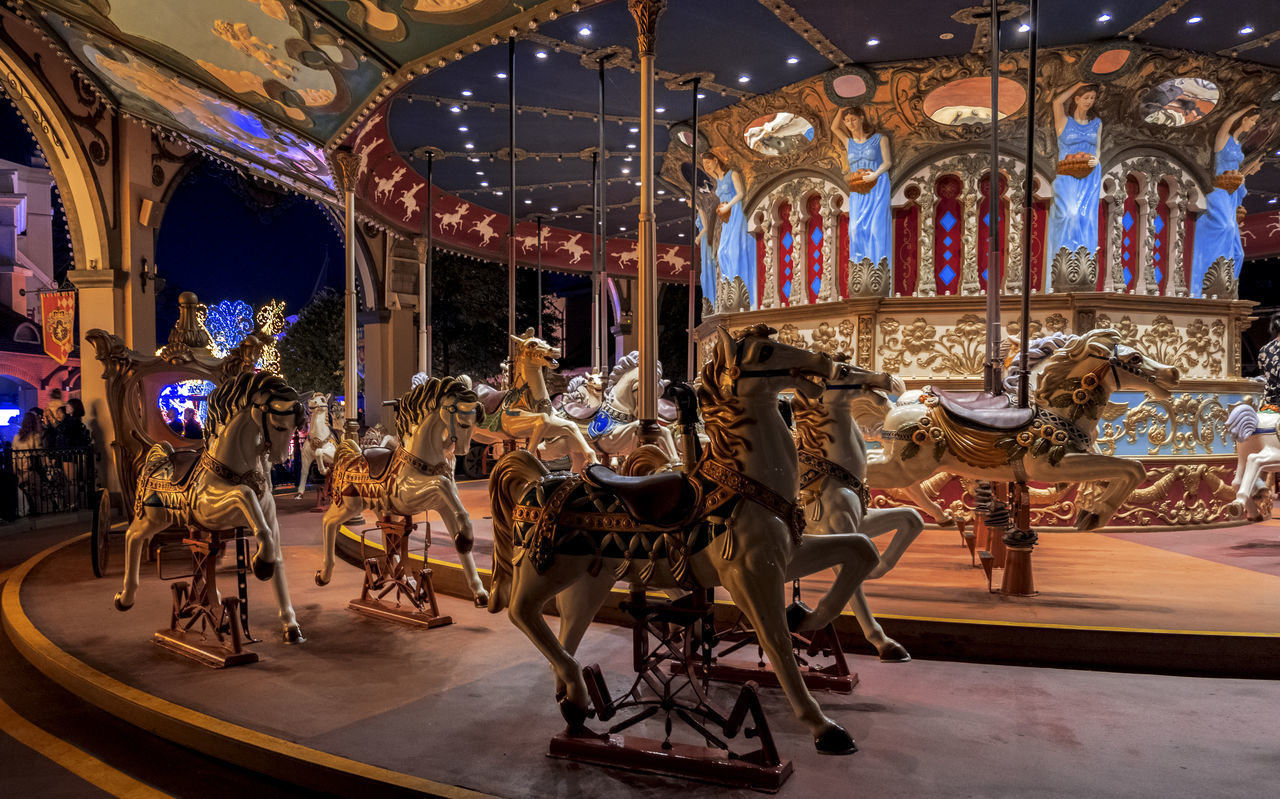 amusement park, carousel, carousel horses, arts culture and entertainment, amusement park ride, animal representation, horse, enjoyment, leisure activity, merry-go-round, recreational pursuit, illuminated, fun, night, no people, indoors