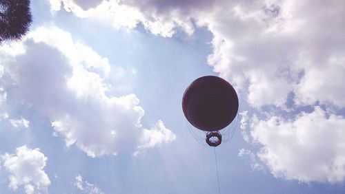 Low angle view of hot air balloon against blue sky