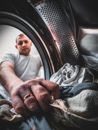 Midsection of man holding machine