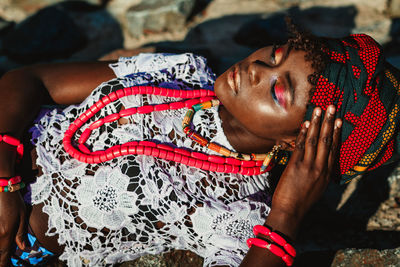 Woman lying on rock