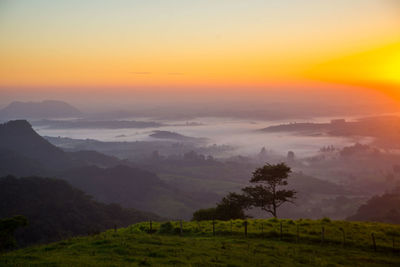 Scenic view of mountains against sky during sunset
