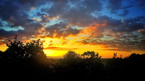 Scenic view of landscape against cloudy sky