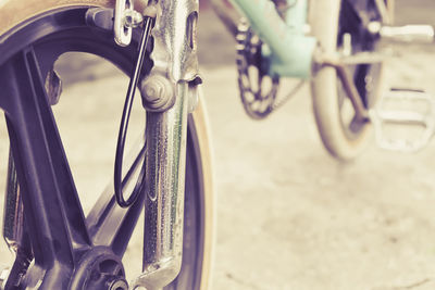 Close-up of bicycle wheel on road