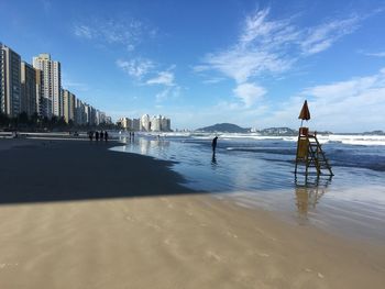 Scenic view of sea against sky in city