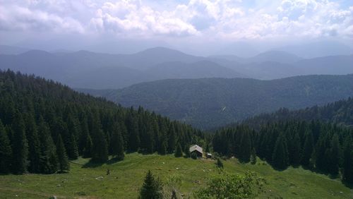 Scenic view of landscape against cloudy sky