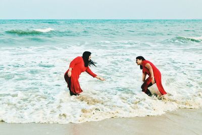 Female friends enjoying in sea