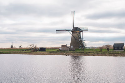 Traditional windmill against sky