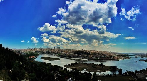 View of harbor against cloudy sky