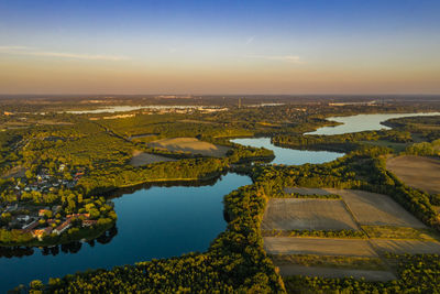 Aerial view of lake against sky during sunset