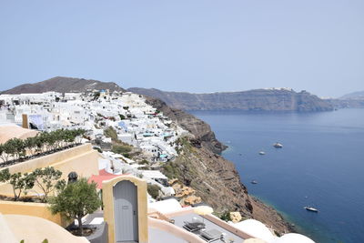 Panoramic view of sea and buildings against clear sky