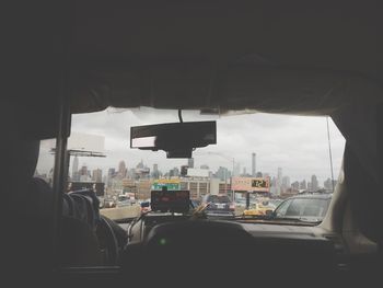 Train seen through car windshield