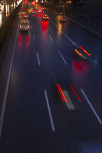 High angle view of light trails on road at night