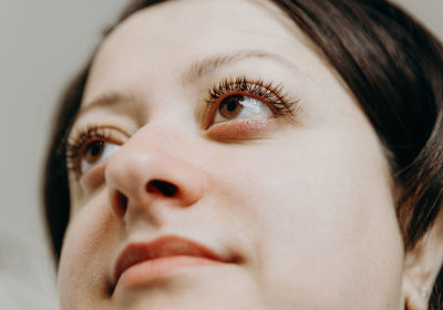 Portrait of a beautiful brunette girl with eyelashes.