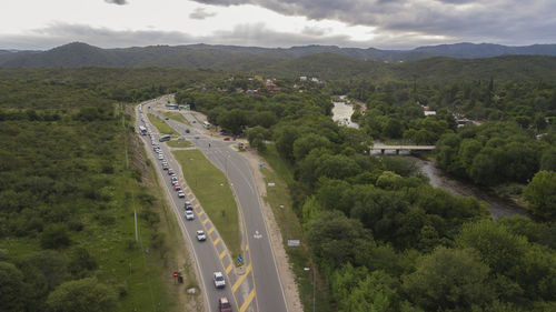 High angle view of highway and trees against sky