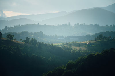 Scenic view of landscape and mountains against sky