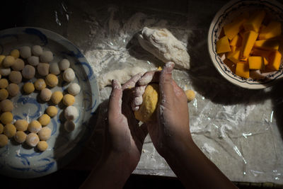 Low section of woman preparing food at home