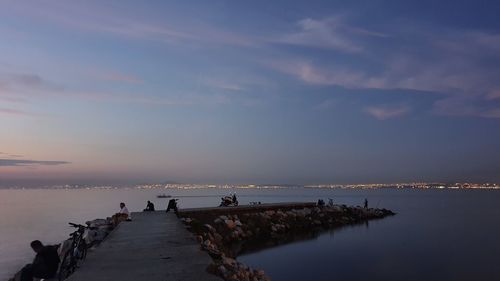 Scenic view of sea against sky at sunset