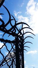 Low angle view of metal structure against sky