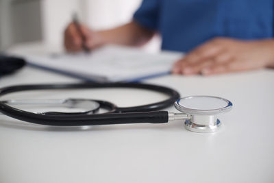 Close-up of stethoscope on desk